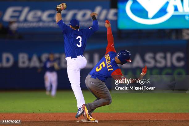 Carlos Gonzalez of Venezuela slides into second in the top of the sixth inning during the World Baseball Classic Pool D Game 7 between Venezuela and...