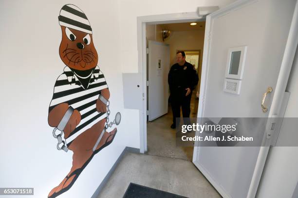 Sgt. Steven Bowles gives a tour where pay-to-stay program inmates can watch television, socialize and play games at the Seal Beach Detention center...