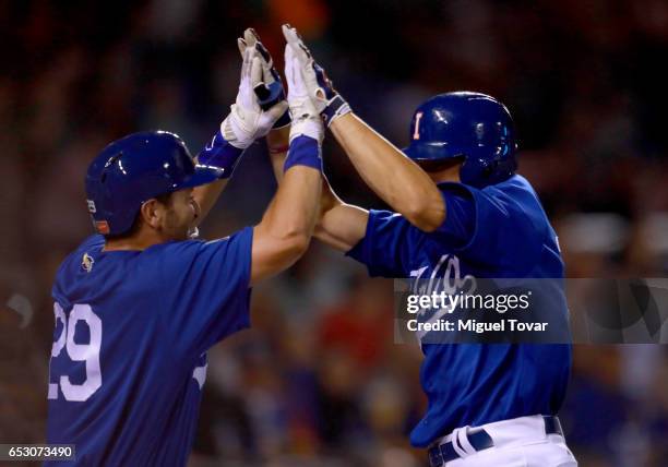 John Andreoli of Italy celebrates after hitting a home run in the bottom of the seventh inning during the World Baseball Classic Pool D Game 7...