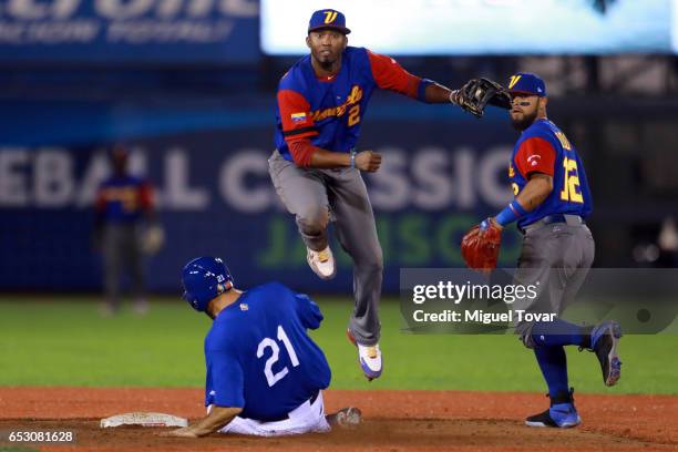 Alcides Escobar of Venezuela throws to first after tagging out Rob Segedin of Italy in the bottom of the eighth inning during the World Baseball...