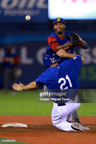 Alcides Escobar of Venezuela throws to first after tagging out Rob Segedin of Italy in the bottom of the eighth inning during the World Baseball...