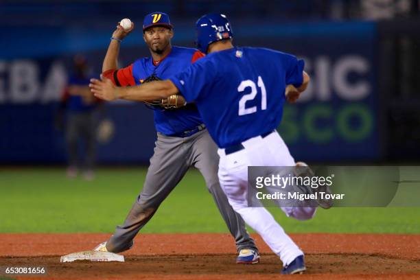 Alcides Escobar of Venezuela throws to first after tagging out Rob Segedin of Italy in the bottom of the eighth inning during the World Baseball...