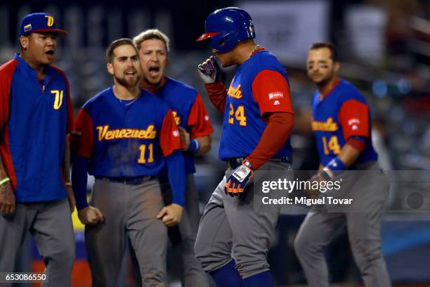 Miguel Cabrera of Venezuela celebrates after hitting a home run in the top of the ninth inning during the World Baseball Classic Pool D Game 7...