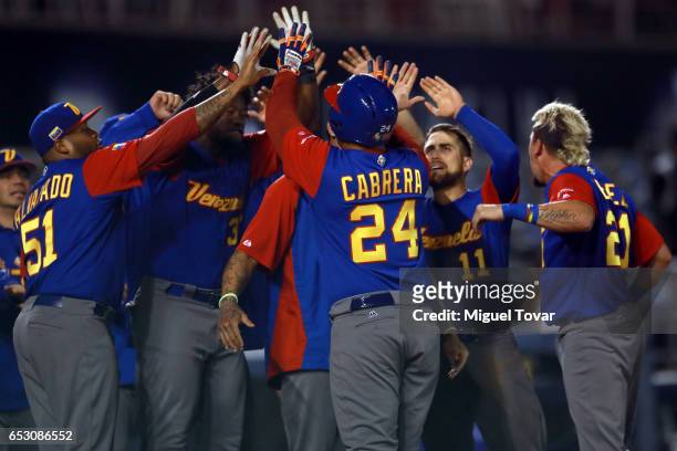 Miguel Cabrera of Venezuela celebrates after hitting a home run in the top of the ninth inning during the World Baseball Classic Pool D Game 7...
