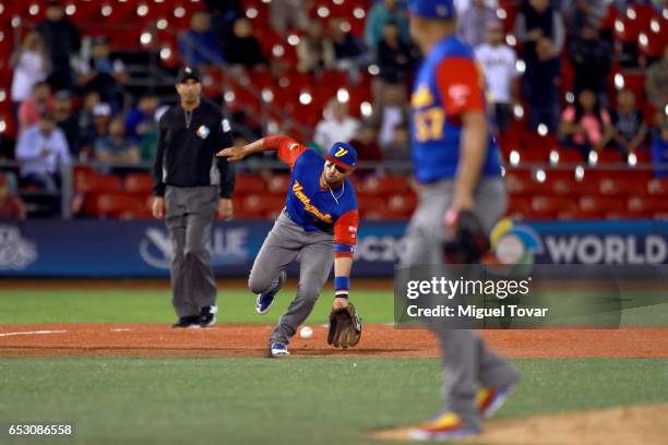 Martin Prado of Venezuela attempts a play in the bottom of the ninth inning during the World Baseball Classic Pool D Game 7 between Venezuela and...