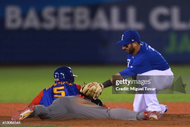 Daniel Descalso of Italy tags out Carlos Gonzalez of Venezuela in the top of the ninth inning during the World Baseball Classic Pool D Game 7 between...