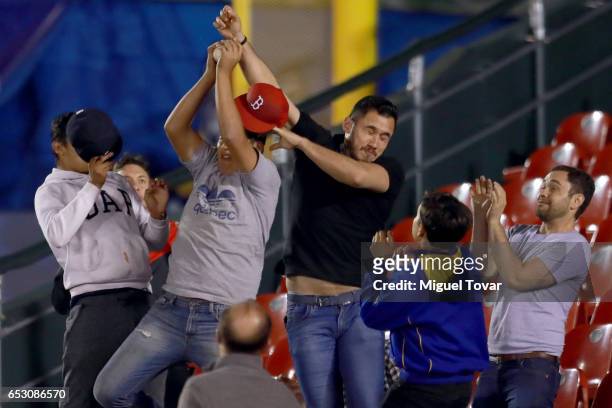 Fans battle for catch a ball during the World Baseball Classic Pool D Game 7 between Venezuela and Italy at Panamericano Stadium on March 13, 2017 in...
