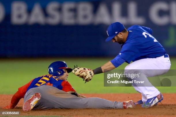 Daniel Descalso of Italy tags out Carlos Gonzalez of Venezuela in the top of the ninth inning during the World Baseball Classic Pool D Game 7 between...