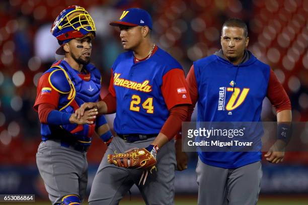 Miguel Cabrera of Venezuela, center, reacts after defeated Italy in the bottom of the ninth inning during the World Baseball Classic Pool D Game 7...