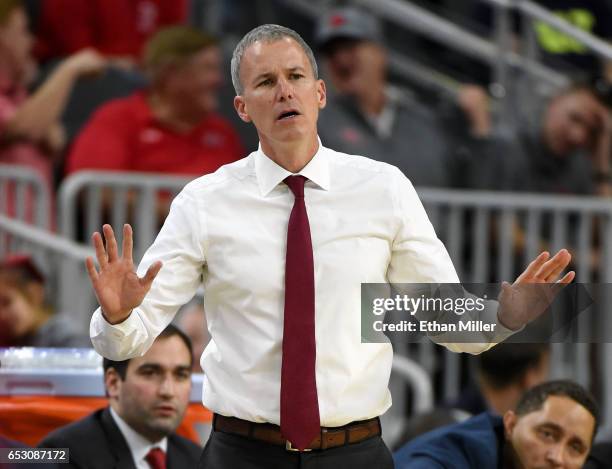 Head coach Andy Enfield of the USC Trojans gestures during a quarterfinal game of the Pac-12 Basketball Tournament against the UCLA Bruins at...