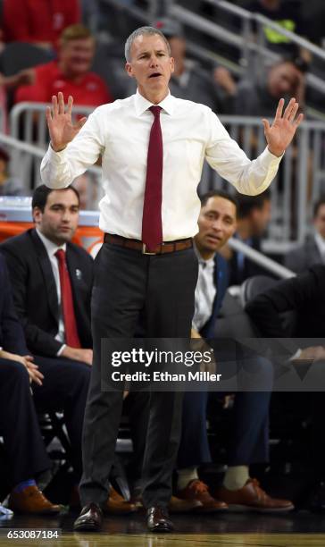 Head coach Andy Enfield of the USC Trojans gestures during a quarterfinal game of the Pac-12 Basketball Tournament against the UCLA Bruins at...