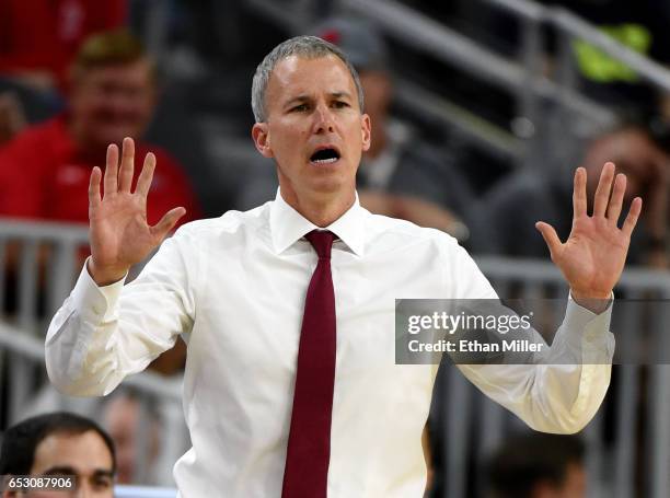 Head coach Andy Enfield of the USC Trojans gestures during a quarterfinal game of the Pac-12 Basketball Tournament against the UCLA Bruins at...