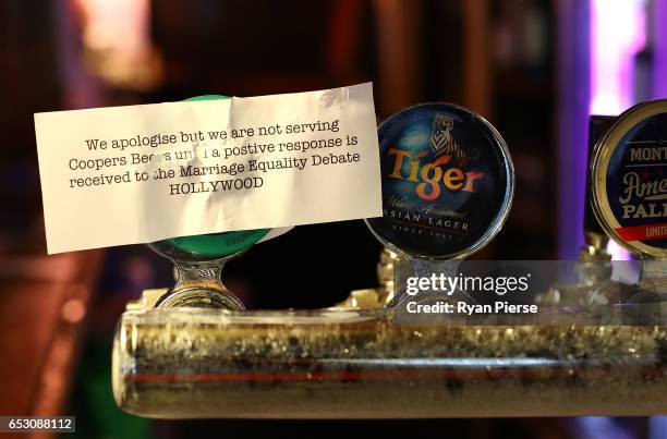 Sign is seen explaining why Coopers Beer is not being served at the Hollywood Hotel on March 14, 2017 in Sydney, Australia. The South Australian...