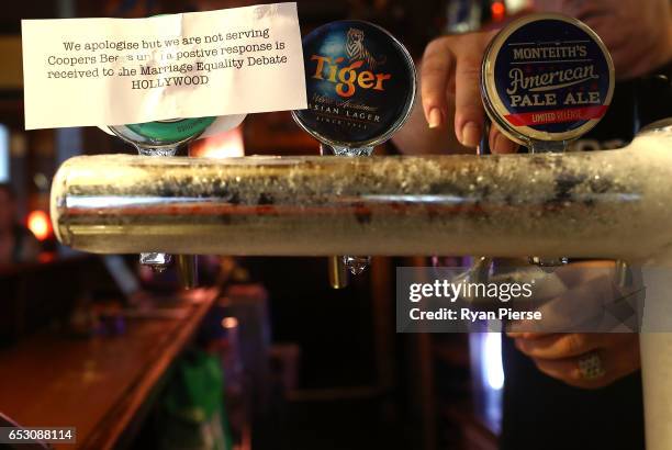 Sign is seen explaining why Coopers Beer is not being served at the Hollywood Hotel on March 14, 2017 in Sydney, Australia. The South Australian...