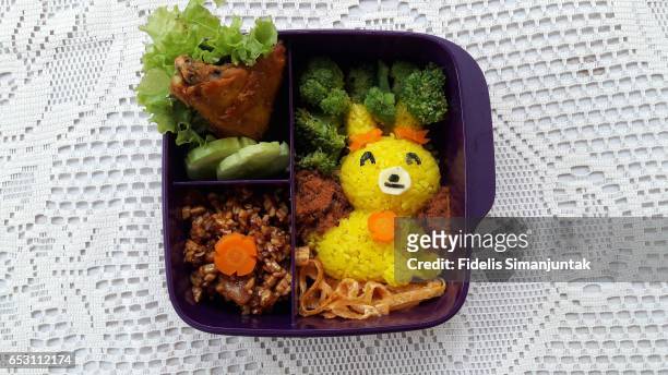 bento set with cute rabbit-shaped yellow rice - bento box stock-fotos und bilder