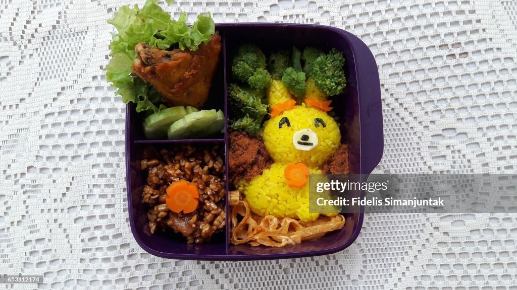 Bento set with cute rabbit-shaped yellow rice
