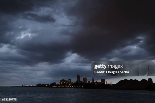 storm clouds over the cleveland skyline - cleveland ohio stock pictures, royalty-free photos & images