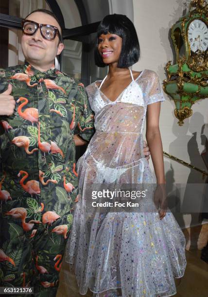 William Arlotti and a model attend William Arlotti Show at Hotel Lancaster Hosted by Domaine de La Croix wines on March 13, 2017 in Paris, France.