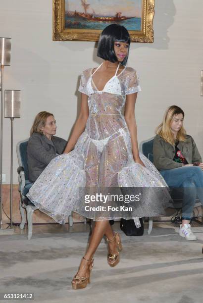 Model walks the runway during the William Arlotti Show at Hotel Lancaster Hosted by Domaine de La Croix wines on March 13, 2017 in Paris, France.