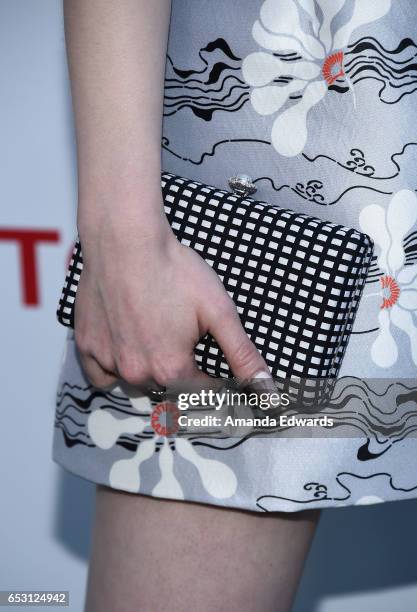 Actress Madelaine Petsch, clutch detail, arrives at the UCLA Institute of the Environment and Sustainability Innovators for a Healthy Planet...