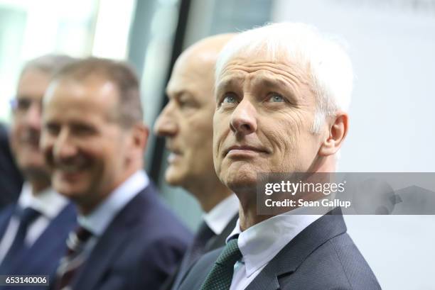 Matthias Mueller , Chairman of German automaker Volkswagen AG, arrives with other VW executives for the company's annual press conference to present...