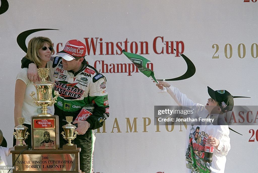Mrs. Labonte Driver Bobby Labonte stands with his wife and son after the Pennzoil ...