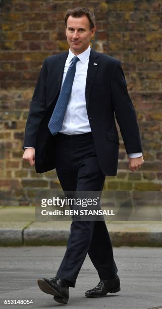 Britain's Health Secretary Jeremy Hunt arrives to attend a weekly cabinet meeting at 10 Downing Street in London on March 14, 2017. - British Prime...