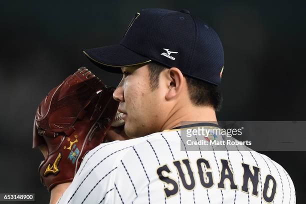 Pitcher Tomoyuki Sugano of Japan warms up prior to the World Baseball Classic Pool E Game Four between Cuba and Japan at the Tokyo Dome on March 14,...