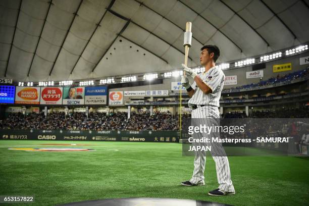 Outfielder Norichika Aoki of Japan warms up prior to the World Baseball Classic Pool E Game Four between Cuba and Japan at the Tokyo Dome on March...