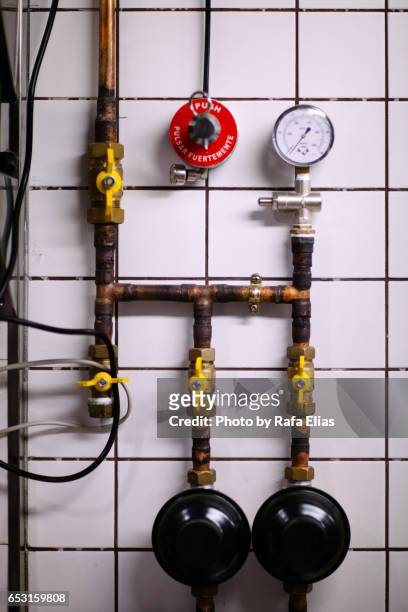 pipes on the wall - trapa stock-fotos und bilder