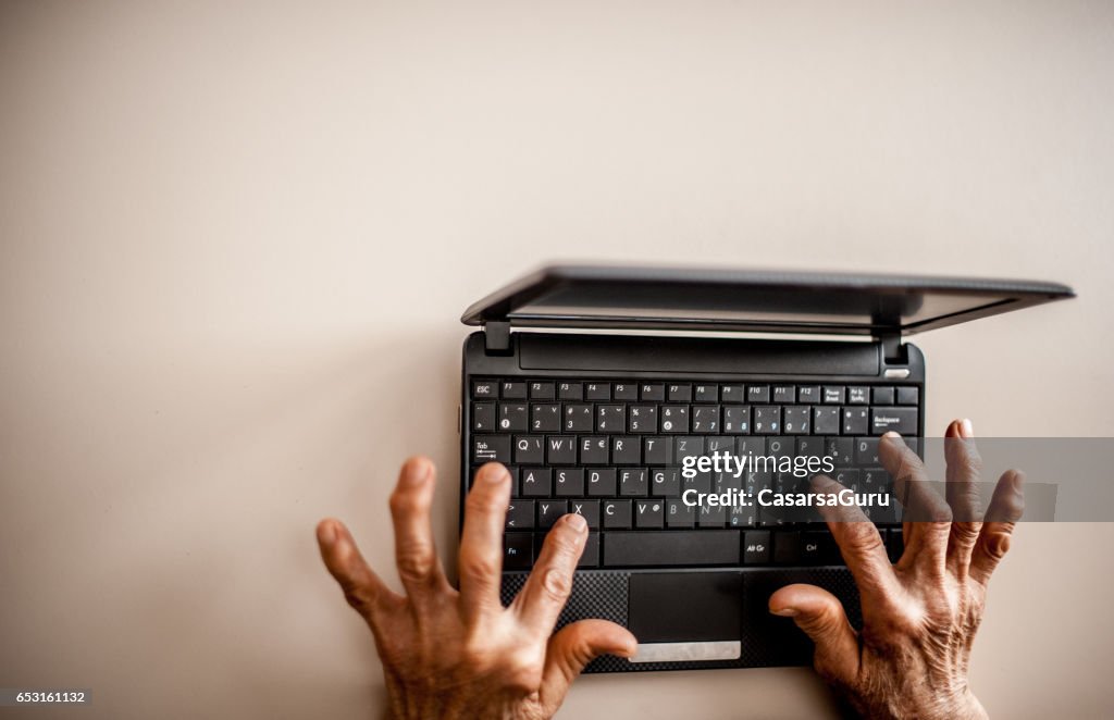 Senior Woman Learning To Use Computer