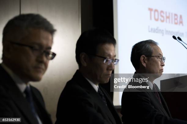 Satoshi Tsunakawa, president of Toshiba Corp., right, Masayoshi Hirata, chief financial officer, center, and Mamoru Hatazawa, vice president of...