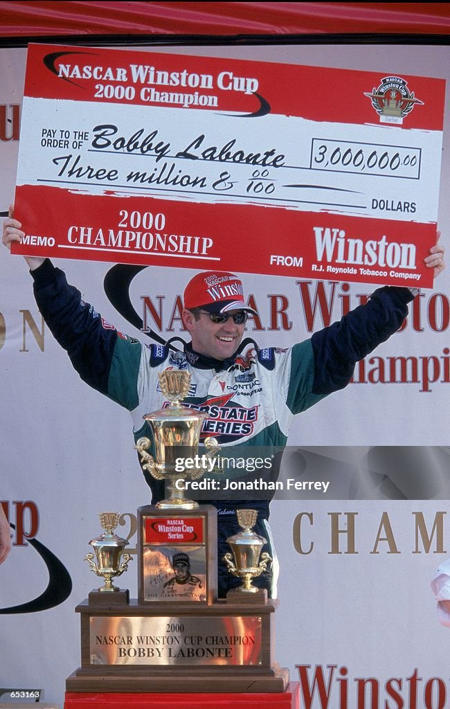 Bobby Labonte Driver Bobby Labonte poses with his winning check after winning the ...