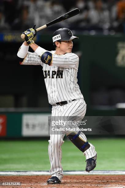 Catcher Seiji Kobayashi of Japan at bat in the bottom of the second inning during the World Baseball Classic Pool E Game Four between Cuba and Japan...