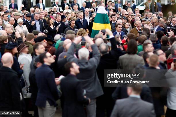 Sir A.P. McCoy waits to unveil a statute of himself at Cheltenham racecourse on day one of the festival meeting on March 14, 2017 in Cheltenham,...