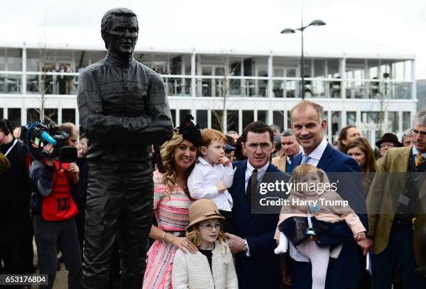 Sir A.P. McCoy poses with his wife Chanelle McCoy, daughter Eve and son Archie and sculptor Paul Ferriter alongside a statue of himself which was...