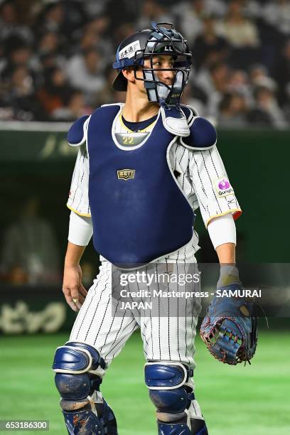 Catcher Seiji Kobayashi of Japan reacts after the top of the fourth inning during the World Baseball Classic Pool E Game Four between Cuba and Japan...