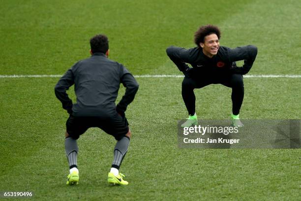 Leroy Sane of Manchester City stretches while warming up during a Manchester City training session prior to the UEFA Champions League Round of 16,...