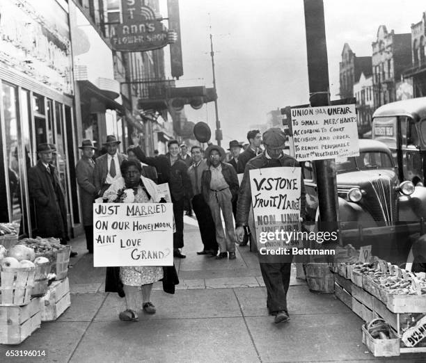 Wearying of the to-and-fro march of a picket in front of his strike-bound produce market in Homestead, proprietor V Stone haired a balck woman to...