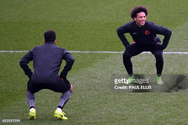 Manchester City's Argentinian striker Sergio Aguero and Manchester City's German midfielder Leroy Sane takes part in a training session at the City...