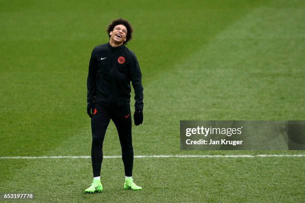 Leroy Sane smiles during a Manchester City training session prior to the UEFA Champions League Round of 16, Second Leg match against Monaco at Etihad...