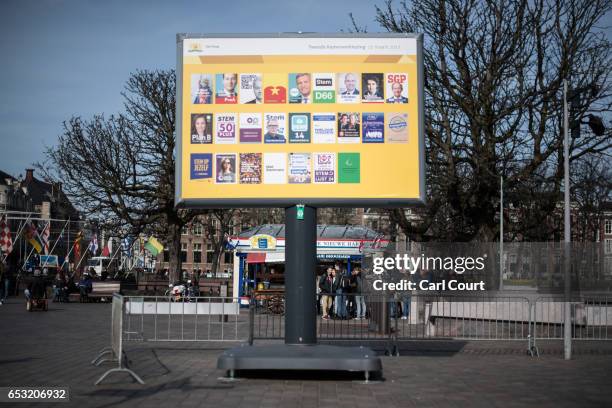 Billboard showing campaign flyers from various Dutch political parties is displayed near the Dutch parliament building on March 14, 2017 in The...