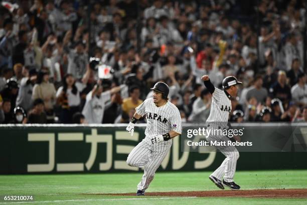 Infielder Nobuhiro Matsuda of Japan runs to the home plate to score a run to make it 5-5 by a RBI single of Catcher Seiji Kobayashi in the bottom of...