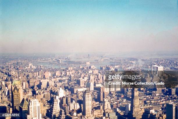 Panoramic view facing northeast of the Lenox Hill neighborhood of upper Manhattan, the East River, northwest Queens, and the southern tip of the...