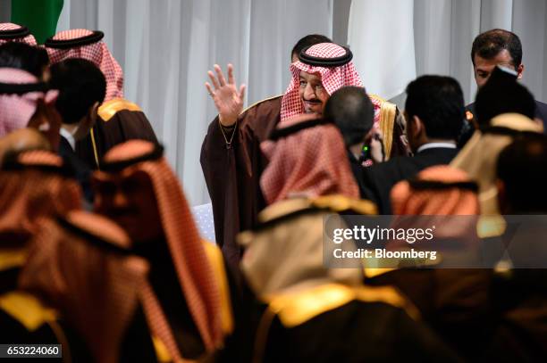 King Salman bin Abdulaziz, Saudi Arabia's king, center, exits after attending the Saudi Arabia-Japan Business Forum for Saudi Arabia Vision 2030 in...