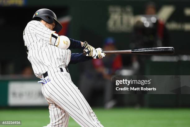 Outfielder Shogo Akiyama of Japan hits a single in the bottom of the eighth inning during the World Baseball Classic Pool E Game Four between Cuba...