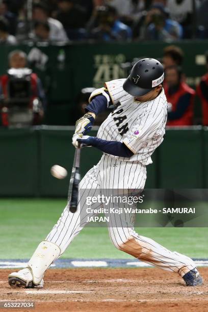 Outfielder Shogo Akiyama of Japan hits a single in the bottom of the eighth inning during the World Baseball Classic Pool E Game Four between Cuba...