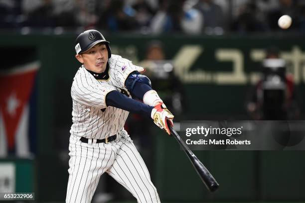 Pinch hitter Outfielder Seiichi Uchikawa of Japan hits a sacrifice fly to make it 5-6 in the bottom of the eighth inning during the World Baseball...