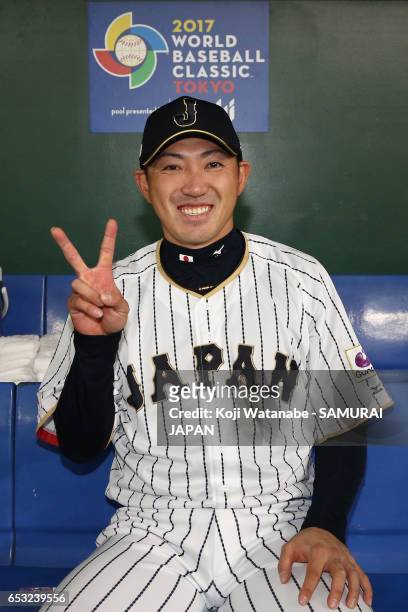 Outfielder Seiichi Uchikawa of Japan poses for photographs after the World Baseball Classic Pool E Game Four between Cuba and Japan at the Tokyo Dome...
