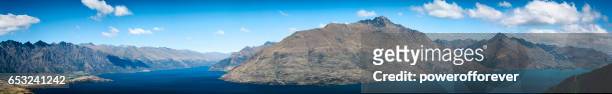 high angle panoramic of queenstown in the remarkable mountains of new zealand - the remarkables stock pictures, royalty-free photos & images